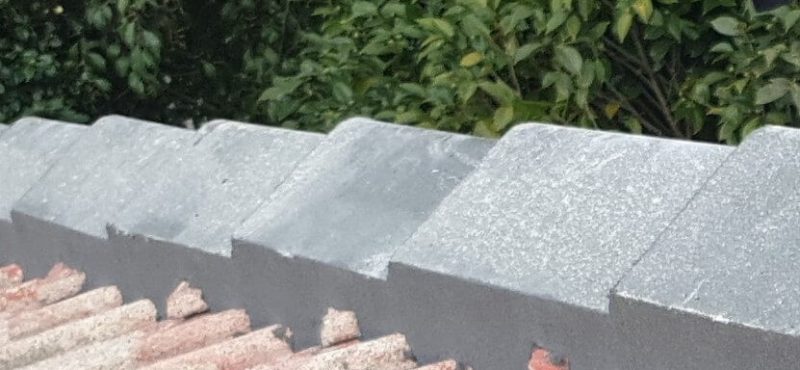 Re-bed and pointing of new ridge-caps with Selleys flexible pointworks before restoration commences by DTK Projects and Maintenance Ltd. in Hamilton, NZ